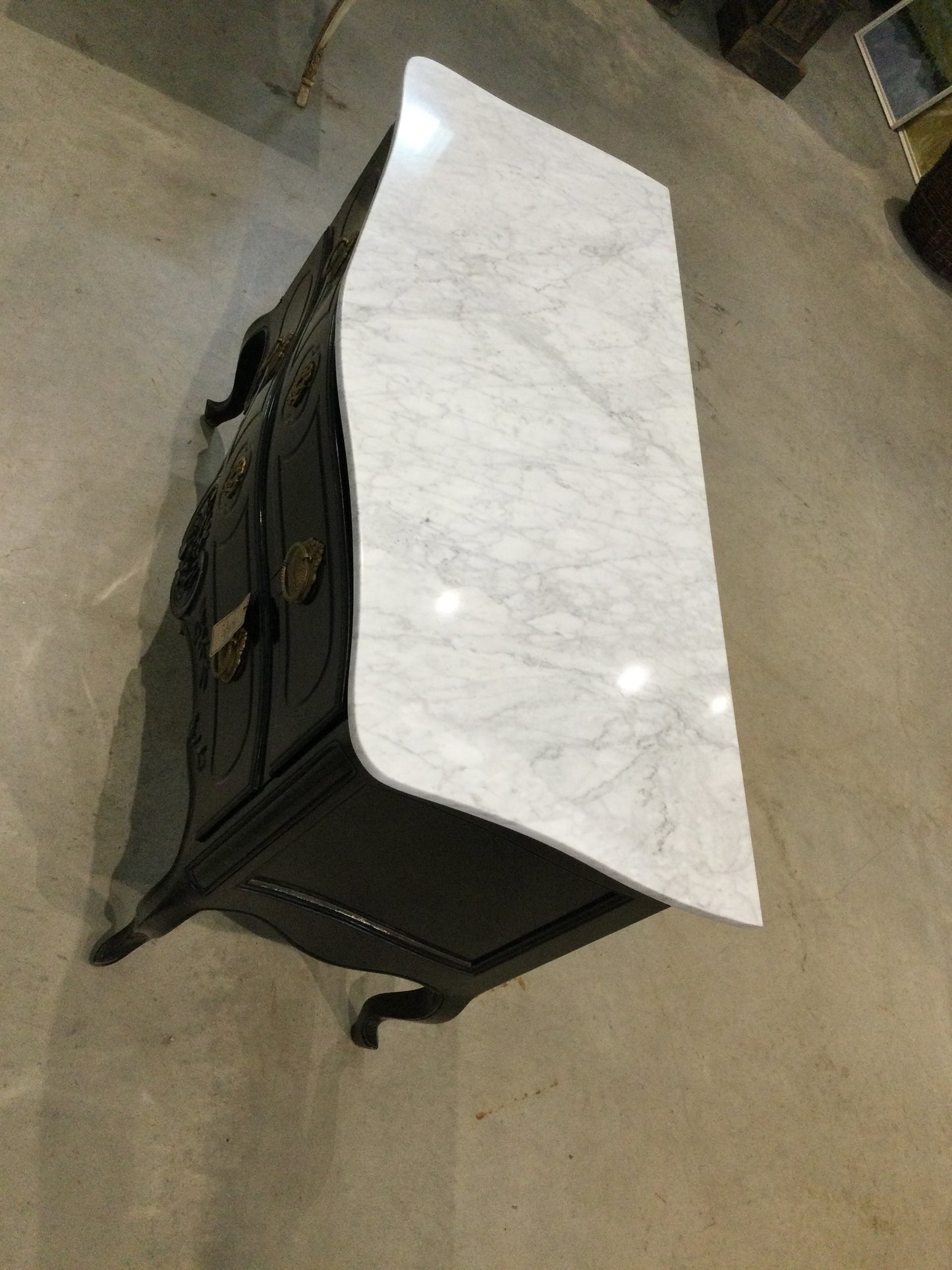 Black Dresser with Brass Handles White Marble Top Front Door Swings Opening