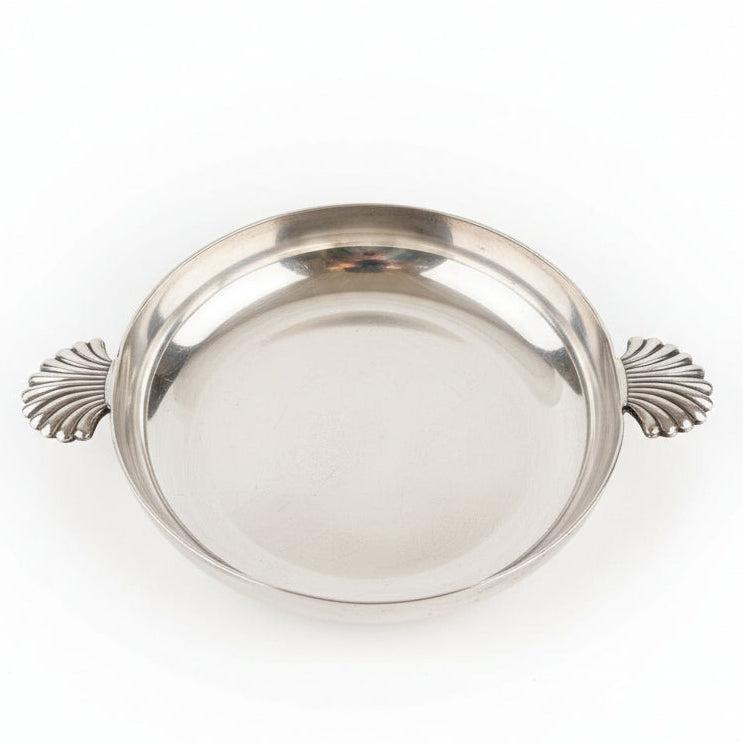 Silver tray with decorative handles on a white background