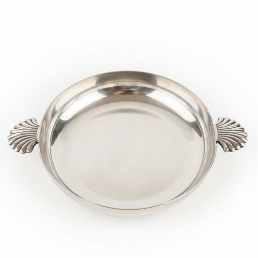 Silver tray with decorative handles on a white background