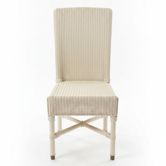 Wicker chair on a concrete floor with a cluttered background