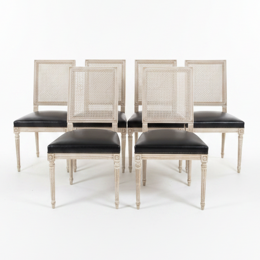 Set of Black Leather and Cane Back Dining Chairs in the Colonial Style