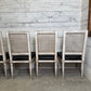 Set of Black Leather and Cane Back Dining Chairs in the Colonial Style