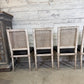 Set of Black Leather and Cane Back Dining Chairs in the Colonial Style