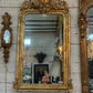 Monumental Louis XVI Style Giltwood Mirror with Foliate Crest