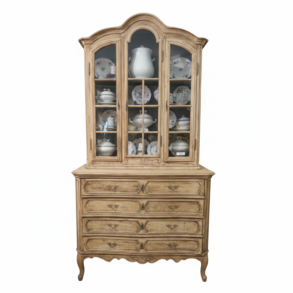 An antique 19th Century French hutch with glass doors and brass handles. The furniture is beige with a blue interior visible through the glass doors.