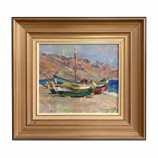 Framed painting of boats on a beach with mountains in the background