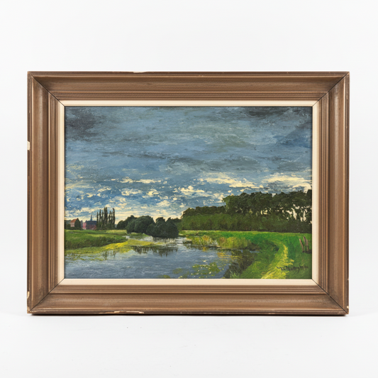Framed landscape painting with a river and trees on a textured surface