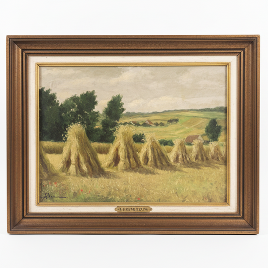 Framed painting of a landscape with hay stacks and trees.