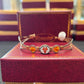 UT Longhorns with two orange jewels Ronaldo bracelet